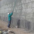 Sealing of walls with cementitious elastomer mortar