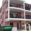 Three-storey building with ground level garage