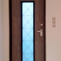 Πόρτα laminate - εισόδου πολυκατοικίας με 1 φεγγίτη