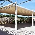 Shading for the outdoor patio of a hotel & restaurant, with installation of electrically powered sliding awning-pergola