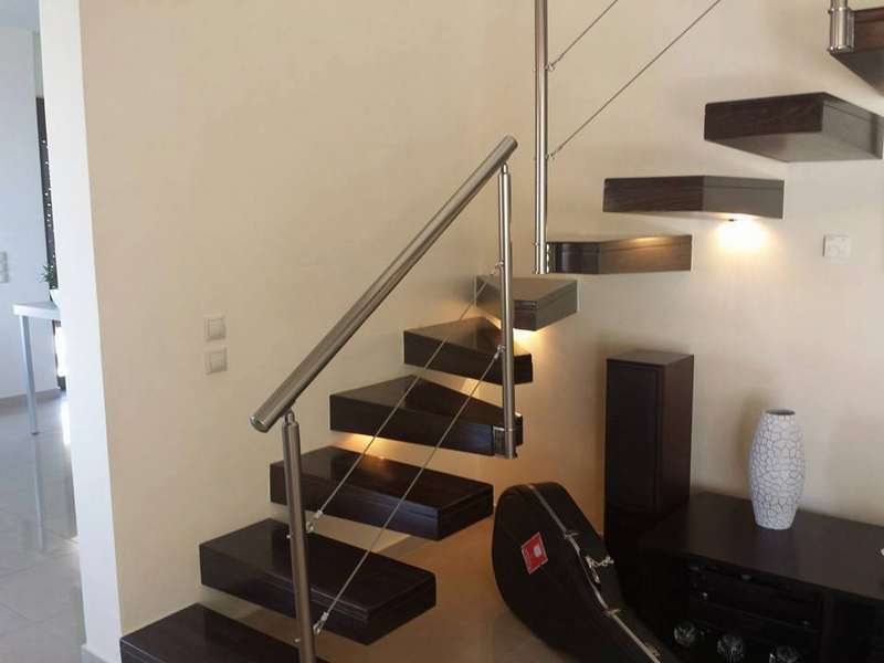 Interior stairs with Inox-type banister rails