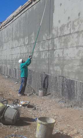 Sealing of walls with cementitious elastomer mortar
