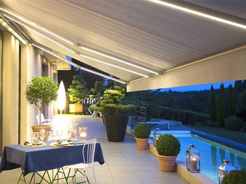 Awnings with a folding arm with LED and Somfy mechanism